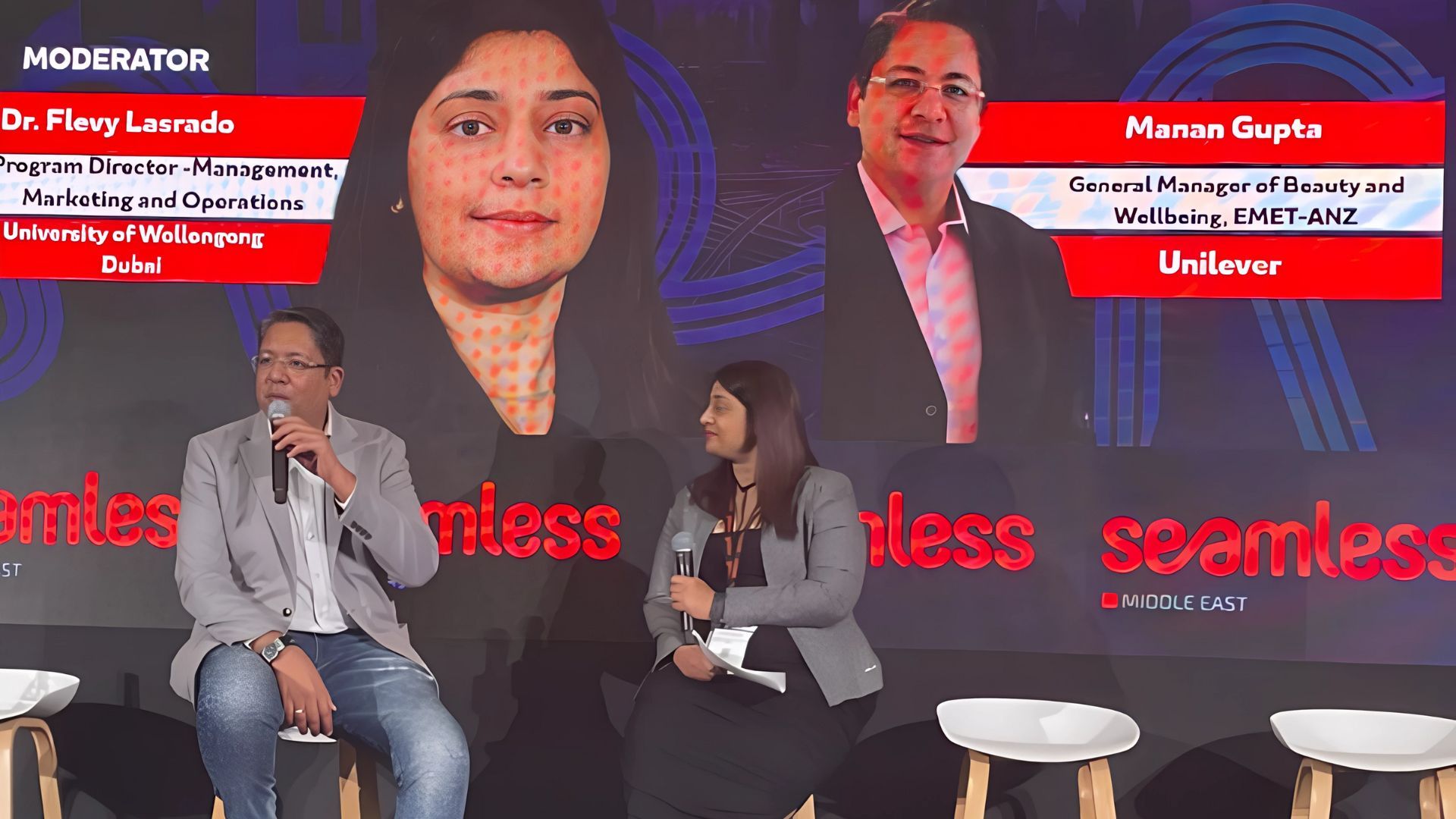 GM of Unilever Beauty & Wellbeing and woman sitting on stools at an event