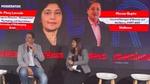 GM of Unilever Beauty & Wellbeing and woman sitting on stools at an event