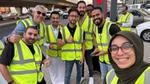 Distributing small meals to those fasting at stop lights during Ramadan