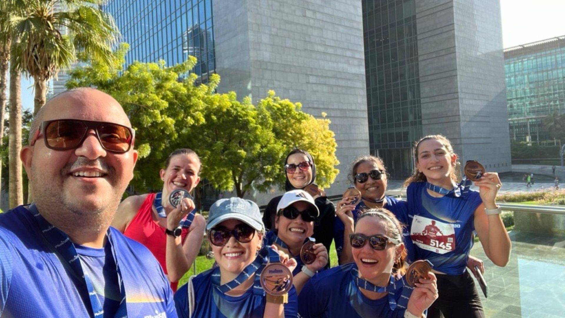 Employees grouped together at the marathon