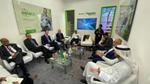 Group of participants sitting in a circle discussing in the panel discussion.