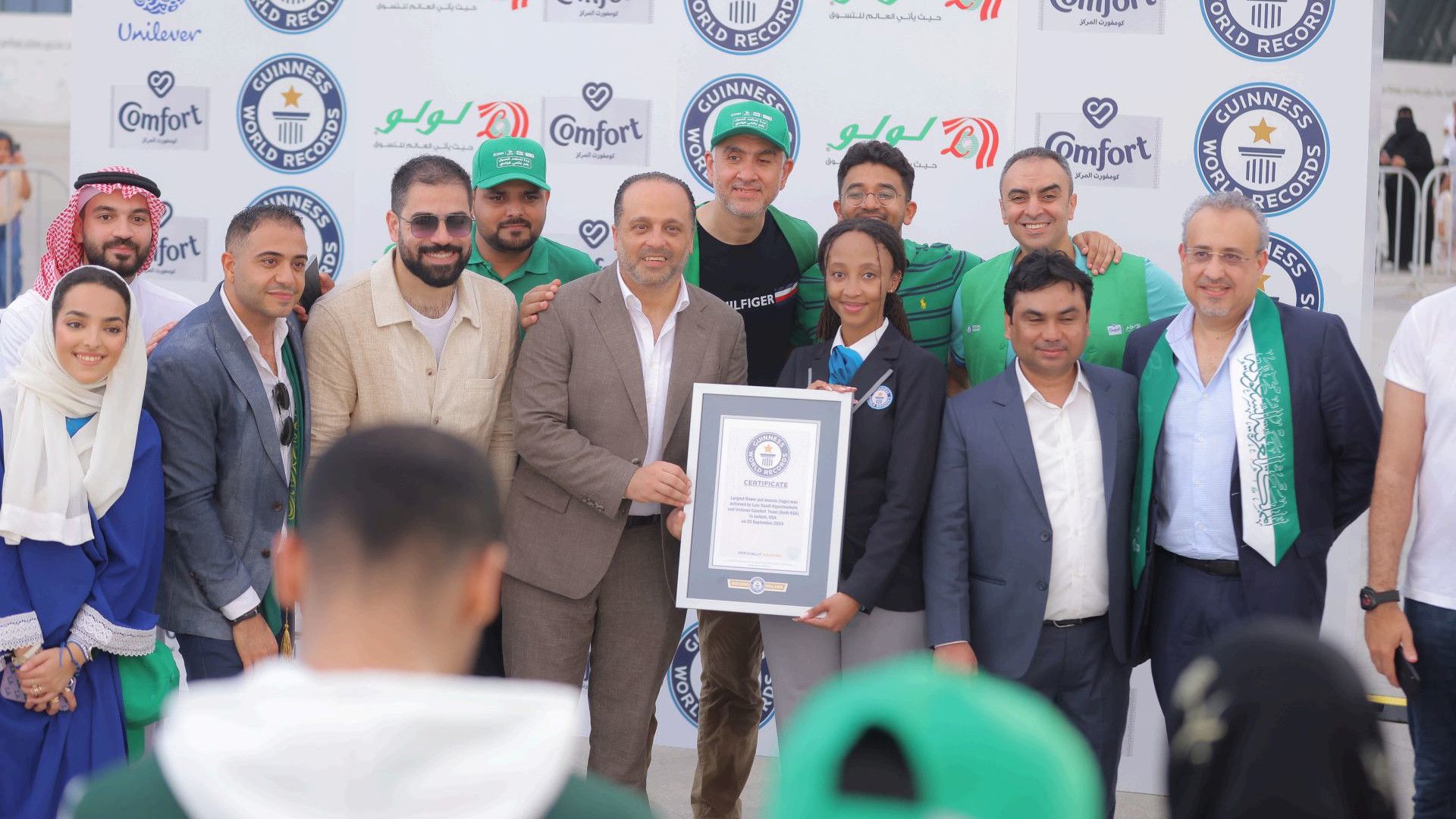Leadership team holding the world record award.