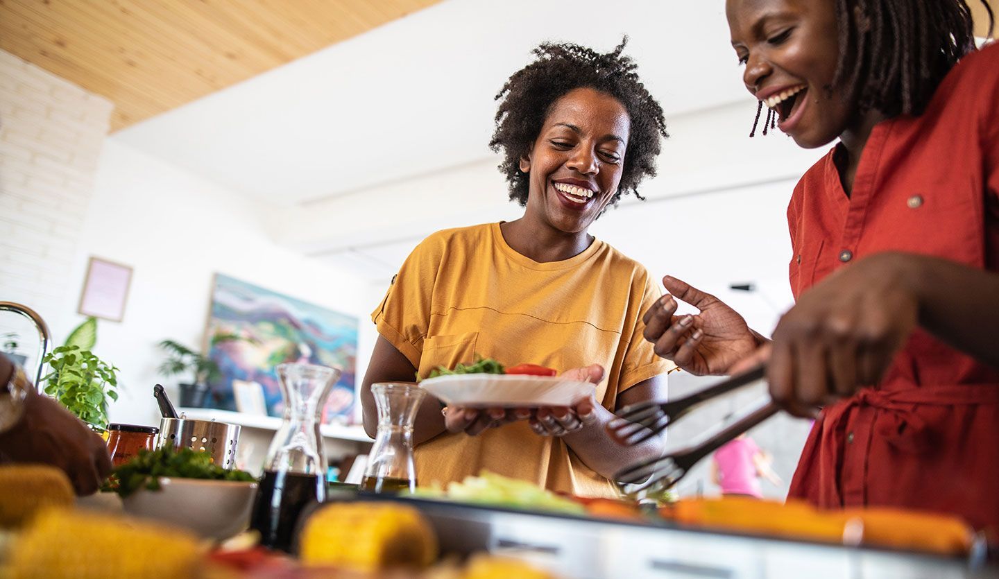 Two women cooking