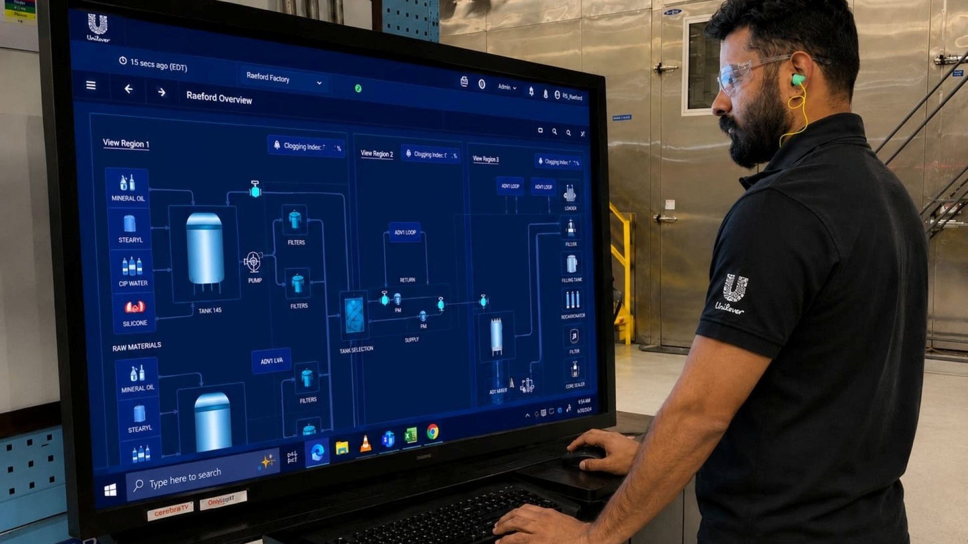 A production line operator at Unilever’s Raeford manufacturing plant working at a screen showing digital twin information.