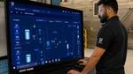 A production line operator at Unilever’s Raeford manufacturing plant working at a screen showing digital twin information.