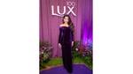 Photo of a woman at the Lux 100th year anniversary celebration