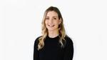 Sarah Potter, Influencer & Media Director for Unilever Personal Care, smiling. Sarah is a blonde woman in a black top.