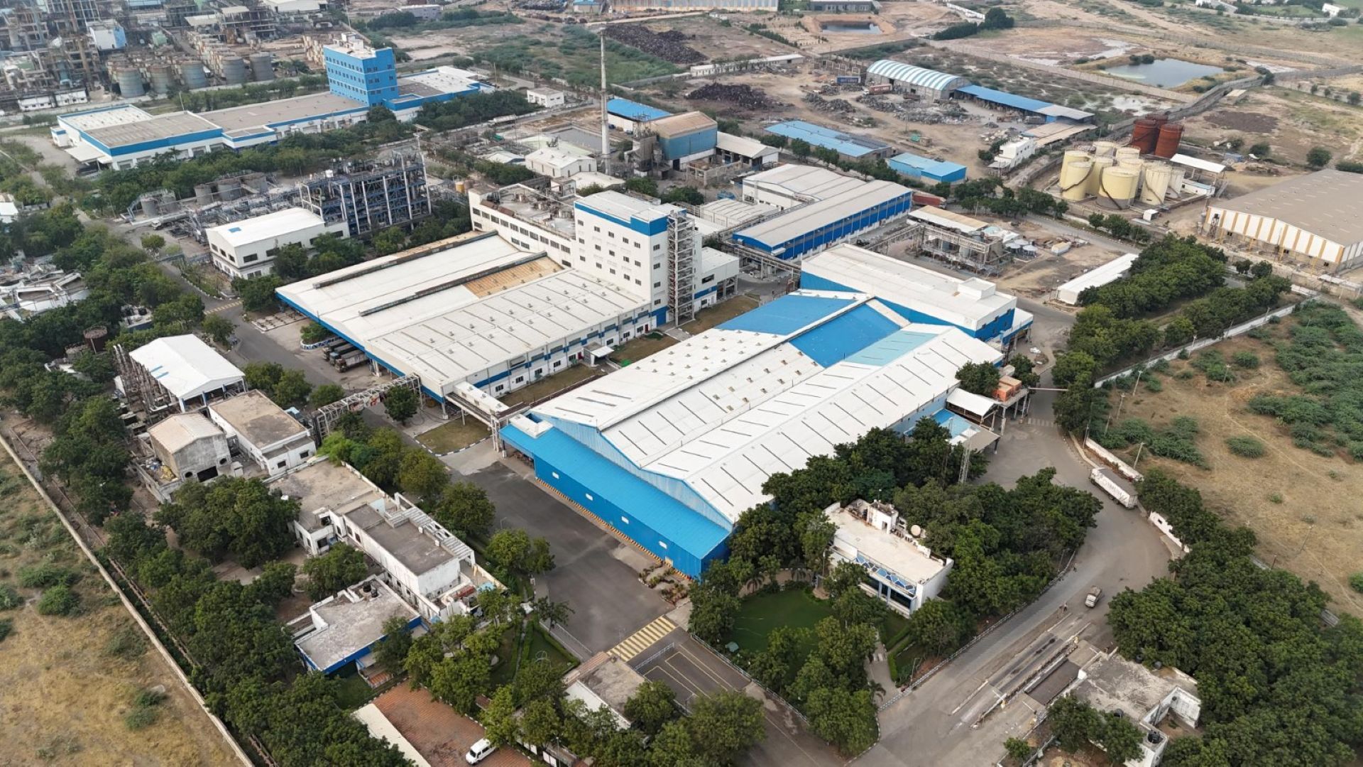 An aerial view of Unilever’s Gandhidham factory in India, a vast manufacturing facility in white and blue.