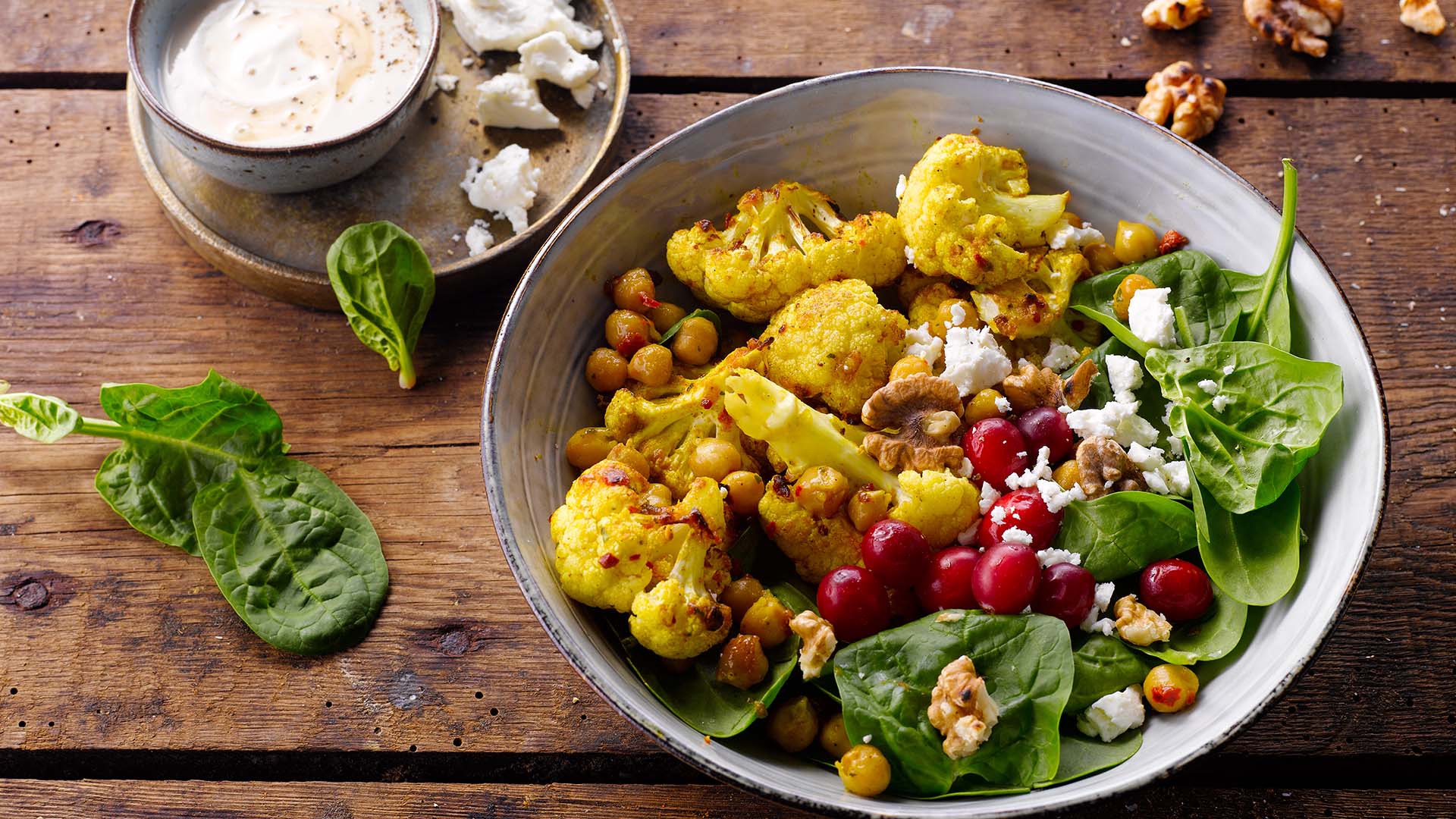 Image of cauliflower in a bowl full of vegetables.
