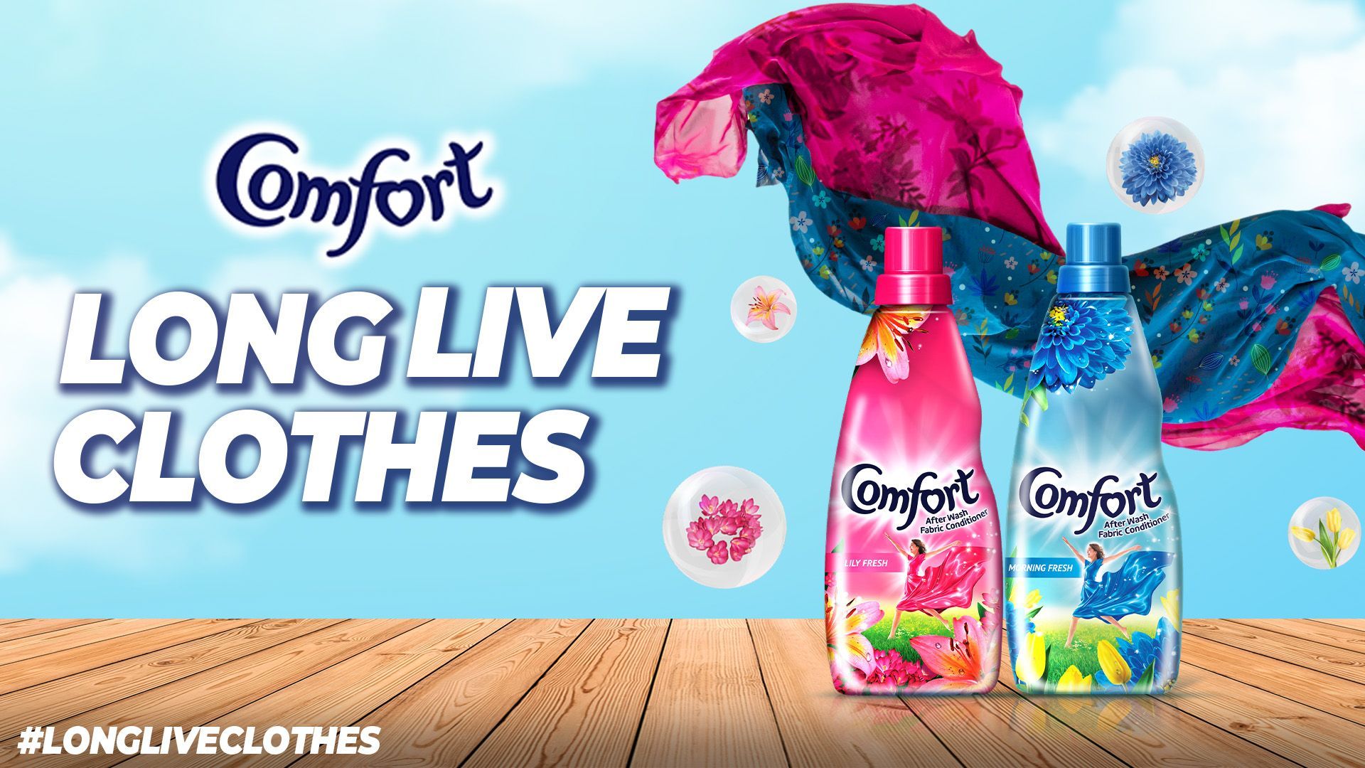 Two bottles of Comfort fabric conditioner, the Comfort logo, and a text that reads "Long live clothes"