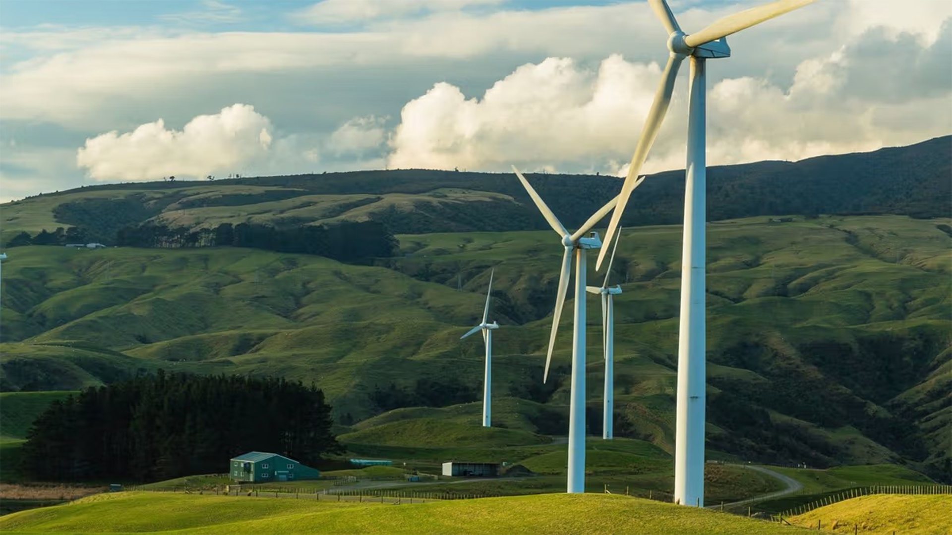 Wind turbines in front of hills